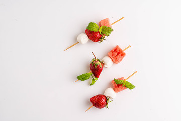 Strawberry with mozzarella and watermelon on the stud
