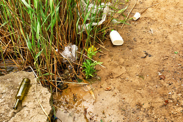 View of garbage near river outdoors. Concept of soil pollution