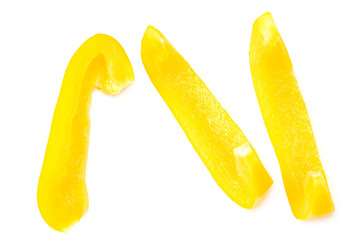 cut slices of yellow sweet bell pepper isolated on white background