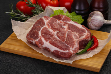 Raw pork neck steak