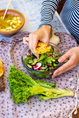 Fresh vegetables salad - radish, lettuce, cucumber, salad leaves. Vegan healthy food