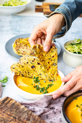 Yellow chickpea beans hummus dip with flatbread tortillas. Vegan food