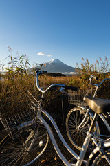 Mount Fuji view from Lake Kawaguchi with bicycles foreground, Yamanashi Prefecture, Japan.