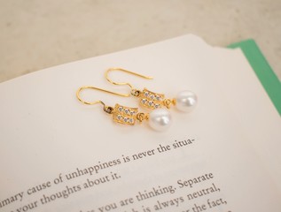 Jewellery photography. Jewelry photography. Open book romantic setup. 