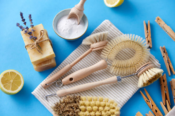 natural cleaning stuff, sustainability and eco living concept - different brushes, lemon, wooden...