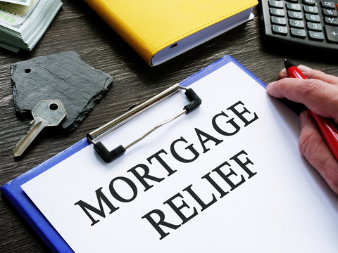 Mortgage Relief Application And Key From Home.