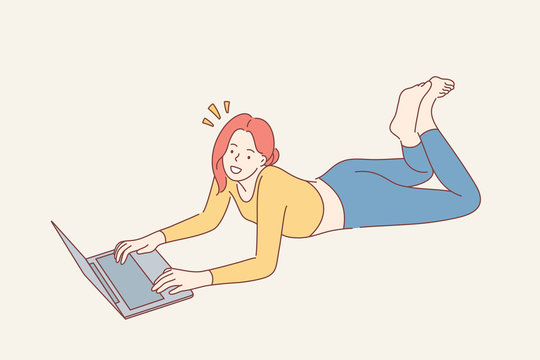 Home Rest, Leisure Time Concept. Young Happy Smiling Woman Girl Teenager Freelancer Cartoon Character Lying On Floor With Laptop And Looking Straight At Camera. Recreation And Relaxation Lifestyle.