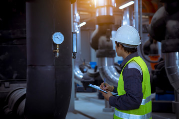 A engineer under checking the industry cooling tower air conditioner is water cooling tower air...