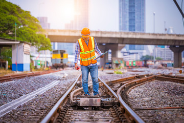 Portrait engineer under inspection and checking construction process railway switch and checking...