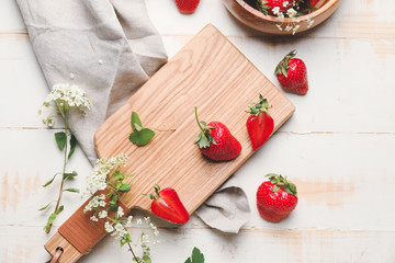 Composition with ripe strawberry on table