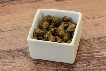 Tasty capers in the bowl