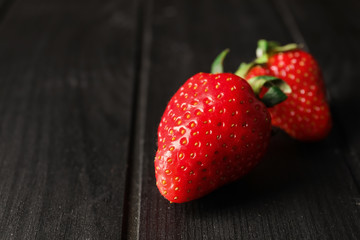 Sweet ripe strawberry on dark background