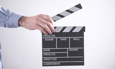 Fototapeta premium Man holding movie clapper. Making movie