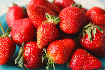 Sweet ripe strawberry on plate, closeup