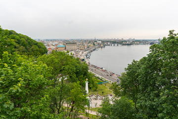 A beatiful view on the center of Kyiv, business and residential buildings, nature in the city, bridge and Dniepr river