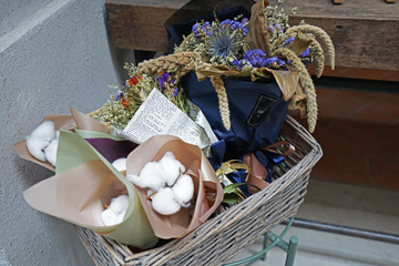 Dried flower bouquet in basket at florist shop