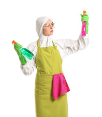 Housewife in protective costume and with cleaning supplies on white background