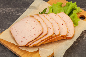 Boiled pork sausage over board