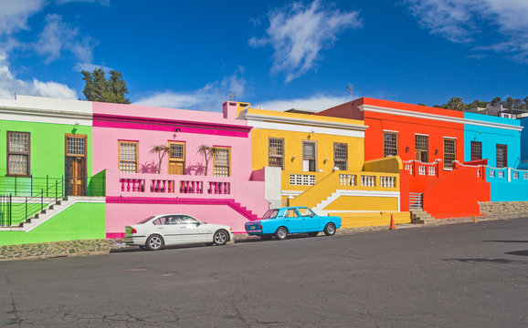 South Africa - Cape Town - The colorful multicolored houses, cottages and cars on steep street in Bo-Kaap borough, one of Cape Town's symbol