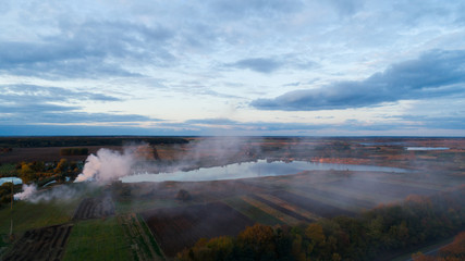 smoke in the field. aerial view