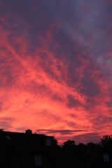 burning sky with houses