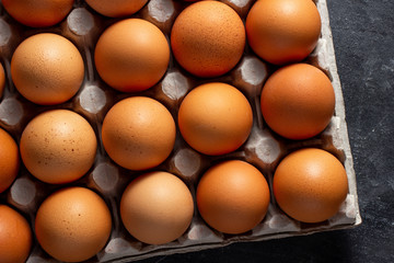 Brown chicken eggs in carton grid box