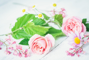 bouquet of pink roses on wooden background