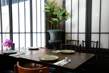 Interior design and decoration with table arrangement at restaurant and coffee cafe