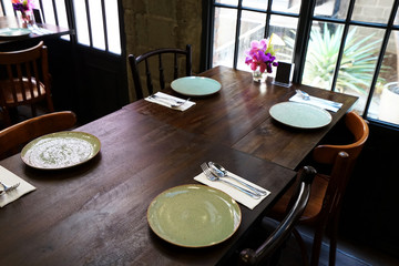 Interior design and decoration with table arrangement at restaurant and coffee cafe