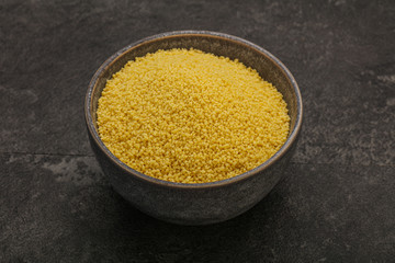 Raw cous cous heap in the bowl