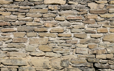 Wall of the old castle made of sandstone.