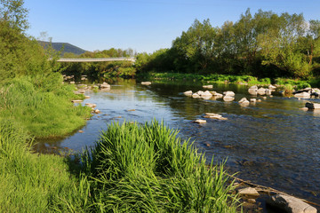 Calm river in mountain region.
