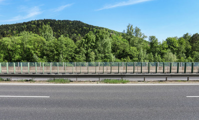 A multi-lane road passes through areas of high landscape value.