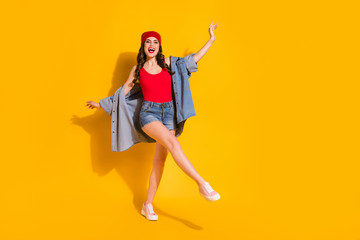 Full length body size view of her she nice attractive lovely glamorous cheerful cheery carefree wavy-haired girl dancing having fun isolated over bright vivid shine vibrant yellow color background