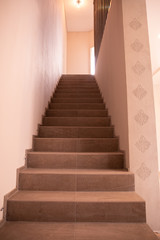 Fototapeta na wymiar Brown staircase with steps in house apartment