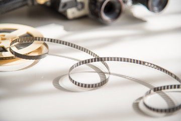 8mm untwisted film on the background of an old movie camera