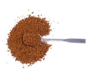 small pile of ground coffee with a silver spoon isolated.