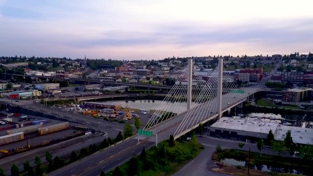 Washington State Route-509 Highway Bridge Over The Thea Foss Waterway Overlooking The City Of Tacoma, Washington , USA,
 At Dawn.  - aerial drone shot