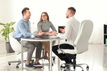 Couple visiting lawyer in office