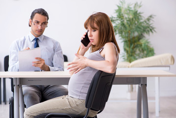 Pregnant woman visiting male psychologist doctor