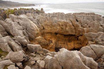 The stunning rocks of Punakaiki, Pancake rocks blowholes, are a tourist attraction. South Island of New Zealand