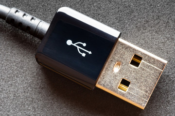 USB cable on black background.