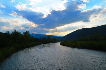mountain river between sheer cliffs . blue clear water of the river.