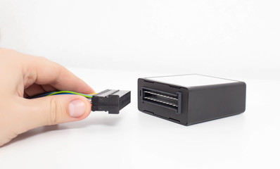External electronic control unit for automatic transmission on a white background. Control unit for gear shifting, parameter analysis and diagnostics, copy space