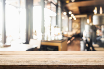 Empty wooden table space platform and blurred resturant or coffee shop background for product display montage