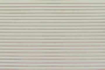 Obraz premium Background of garage door made of metal stripes, close-up