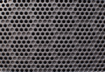 Modern speaker protection grill in a car, background, closeup, copy space