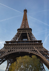 eiffel tower in paris with nice blue sky and clouds