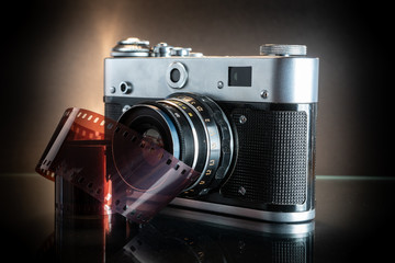 Old photocamera and negative.
