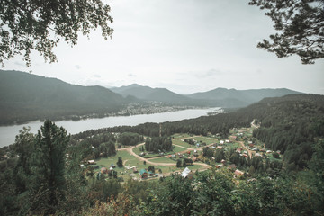 View from mountain on Teletskoye lake in Altai mountains, Siberia, Russia. Panorama of lake. Beauty summer day.